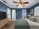 Charming bedroom featuring a ceiling fan, wood-look flooring, and a soothing color scheme at 1238 Honeytree E Ln, Lakeland, FL 33801