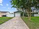 Charming one-story home featuring a well-maintained front yard and a spacious driveway leading to a two-car garage at 1238 Honeytree E Ln, Lakeland, FL 33801