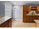 Kitchen with ample cabinetry, stainless steel sink, and granite counters, offering functionality and style at 1238 Honeytree E Ln, Lakeland, FL 33801