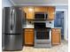 Modern kitchen featuring stainless steel appliances, stylish cabinetry, and elegant countertops at 1238 Honeytree E Ln, Lakeland, FL 33801