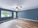 Bright living room with wood-look flooring and a window that offers natural light at 1238 Honeytree E Ln, Lakeland, FL 33801