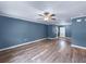 Bright living room boasting new floors, fresh paint, and ceiling fan at 1238 Honeytree E Ln, Lakeland, FL 33801