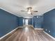 Open-concept living room featuring new floors, fresh paint, and trim details at 1238 Honeytree E Ln, Lakeland, FL 33801