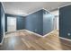 Spacious living room featuring new floors, fresh paint, and modern lighting at 1238 Honeytree E Ln, Lakeland, FL 33801