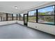 Large windows showcase views of the backyard and pool from inside the sunroom at 1238 Honeytree E Ln, Lakeland, FL 33801