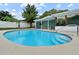 Sparkling blue swimming pool with sun-soaked deck, and screened lanai, perfect for relaxation and entertainment at 1238 Honeytree E Ln, Lakeland, FL 33801
