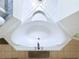 A high angle view of a soaking tub with white tile surround and beige floor tiles at 449 Moscato Dr, Davenport, FL 33897