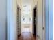 Hallway view of the bathroom with a bathtub and closet at 449 Moscato Dr, Davenport, FL 33897