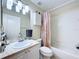 Full bathroom with vanity, updated fixtures, and a shower-tub combination at 449 Moscato Dr, Davenport, FL 33897