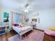 A decorated bedroom with whimsical touches and a pink color scheme at 449 Moscato Dr, Davenport, FL 33897