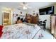 Spacious bedroom setup with desk, television and adjacent bathroom entrance at 449 Moscato Dr, Davenport, FL 33897