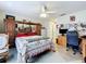 Comfortable bedroom setup with desk, dresser, and a cozy bed setup at 449 Moscato Dr, Davenport, FL 33897