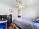 Bedroom featuring full bed, ceiling fan, window, and doorway at 449 Moscato Dr, Davenport, FL 33897