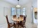 Breakfast nook featuring wood table and chairs with ample natural light at 449 Moscato Dr, Davenport, FL 33897