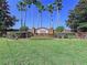 Tuscan Ridge entrance sign surrounded by lush landscaping, manicured shrubs, and mature trees at 449 Moscato Dr, Davenport, FL 33897
