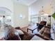 Bright living room with hardwood floors connecting the living spaces at 449 Moscato Dr, Davenport, FL 33897