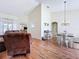 Open concept living and dining room featuring hardwood flooring at 449 Moscato Dr, Davenport, FL 33897