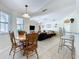 Open living space with breakfast nook overlooking the living room at 449 Moscato Dr, Davenport, FL 33897