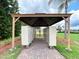 Community mailbox station featuring rows of mailboxes under a protective shelter at 449 Moscato Dr, Davenport, FL 33897
