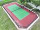 Aerial view of a community tennis court enclosed by a black fence at 449 Moscato Dr, Davenport, FL 33897