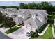A beautiful townhouse community, lush landscaping, and tile roofs at 776 Grasslands Village Cir # 776, Lakeland, FL 33803
