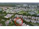 Beautiful aerial view of the neighborhood with well maintained homes, ponds and mature trees creating an idyllic setting at 776 Grasslands Village Cir # 776, Lakeland, FL 33803