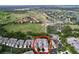 Aerial view of community featuring well-maintained residences, lush landscaping, and access to a golf course at 776 Grasslands Village Cir # 776, Lakeland, FL 33803