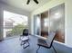 Relaxing balcony with outdoor chairs and sliding glass doors at 776 Grasslands Village Cir # 776, Lakeland, FL 33803