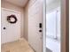Inviting entryway featuring a decorative wreath and neutral tones at 776 Grasslands Village Cir # 776, Lakeland, FL 33803