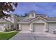 Charming exterior view of this residential townhome showcasing well-kept landscaping and an attached garage at 776 Grasslands Village Cir # 776, Lakeland, FL 33803