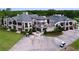 Impressive exterior of a large, luxurious home with a sprawling layout, balconies, and meticulously landscaped grounds at 776 Grasslands Village Cir # 776, Lakeland, FL 33803