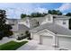 Townhome featuring elegant architectural details and manicured landscaping at 776 Grasslands Village Cir # 776, Lakeland, FL 33803