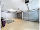 Well-maintained garage featuring an epoxy floor and ample space at 776 Grasslands Village Cir # 776, Lakeland, FL 33803