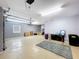 Large, organized garage space with epoxy floor, featuring storage and open areas at 776 Grasslands Village Cir # 776, Lakeland, FL 33803
