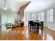 Open living space featuring a combined living and dining area with hardwood floors and natural light at 776 Grasslands Village Cir # 776, Lakeland, FL 33803