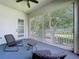 Relaxing screened patio seating area overlooking landscaped yard at 776 Grasslands Village Cir # 776, Lakeland, FL 33803