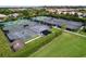 Aerial view of multiple tennis and pickleball courts surrounded by manicured landscaping at 776 Grasslands Village Cir # 776, Lakeland, FL 33803