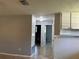 Hallway with tile flooring leads to rooms in the house at 835 5Th St, Port Orange, FL 32129