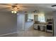 Traditional kitchen with white cabinets, tile floors, and stainless steel refrigerator at 835 5Th St, Port Orange, FL 32129