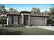 Charming single-story home with a two-car garage, landscaped yard, and inviting front entrance at 1625 Nantucket Way, Winter Haven, FL 33884