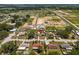 Aerial shot indicating the property's placement in a neighborhood with trees, houses, and open landscapes at 3983 Shay Dr, Bartow, FL 33830