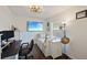Cozy bedroom includes wood floors, a daybed, and a large television, perfect for relaxation at 3983 Shay Dr, Bartow, FL 33830