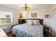 Comfortable bedroom featuring a plush bed, classic furnishings, and soft natural light at 3983 Shay Dr, Bartow, FL 33830
