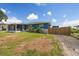 Charming single-story home with a well-manicured lawn, mature landscaping, and fenced yard at 3983 Shay Dr, Bartow, FL 33830