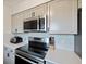 Close up of updated kitchen with stainless steel appliances, quartz countertops, and modern backsplash at 3983 Shay Dr, Bartow, FL 33830