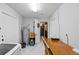 Spacious laundry room with modern appliances, a utility sink, and plenty of storage space at 3983 Shay Dr, Bartow, FL 33830