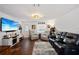 Spacious living room with modern furnishings, sleek leather seating, and lots of natural light at 3983 Shay Dr, Bartow, FL 33830