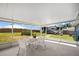 Spacious screened patio with outdoor seating and views of the backyard and RV parking at 3983 Shay Dr, Bartow, FL 33830