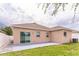 The backyard has a gray patio and green grass at 547 Sardinia Cir, Davenport, FL 33837