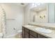Bright bathroom with double vanity, stylish countertop and cabinetry, and a shower with curtain at 547 Sardinia Cir, Davenport, FL 33837